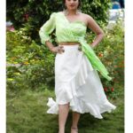 Hariprriya Instagram – Beauty attracts the eye but style captures the heart✨💚
#StylishSunday

Beautiful Citrus Draped Top paired with White Skirt designed by 🤩 – @nineonine_designstudio 
Beautifully captured by 😍 – @candidclicks1