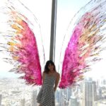 Harshika Poonacha Instagram - Flying #atthetop #burjkhalifa 💗💗💗 My winggame at the world's tallest building 🥰 I told you I can fly 🙈 @burjkhalifa @dubai Photo credit : @anto.abra Dubai, United Arab Emirates