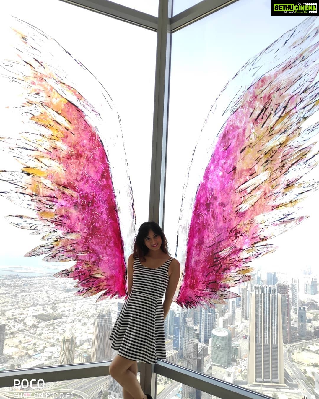 Harshika Poonacha Instagram - Flying #atthetop #burjkhalifa 💗💗💗 My winggame at the world's tallest building 🥰 I told you I can fly 🙈 @burjkhalifa @dubai Photo credit : @anto.abra Dubai, United Arab Emirates