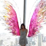 Harshika Poonacha Instagram - Flying #atthetop #burjkhalifa 💗💗💗 My winggame at the world's tallest building 🥰 I told you I can fly 🙈 @burjkhalifa @dubai Photo credit : @anto.abra Dubai, United Arab Emirates