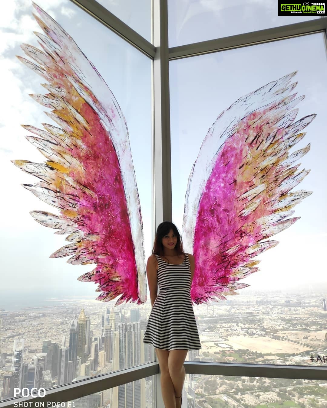 Harshika Poonacha Instagram - Flying #atthetop #burjkhalifa 💗💗💗 My winggame at the world's tallest building 🥰 I told you I can fly 🙈 @burjkhalifa @dubai Photo credit : @anto.abra Dubai, United Arab Emirates