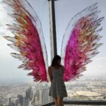 Harshika Poonacha Instagram - Flying #atthetop #burjkhalifa 💗💗💗 My winggame at the world's tallest building 🥰 I told you I can fly 🙈 @burjkhalifa @dubai Photo credit : @anto.abra Dubai, United Arab Emirates