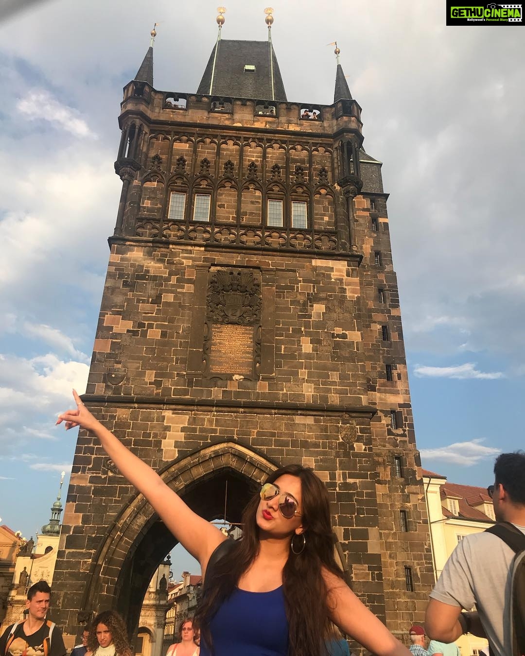 Harshika Poonacha Instagram - Monkeying around the beautiful #CharlesBridge and the soothing blue sky ❤️❤️❤️ @prague #Prague #Praha #CzechRepublic #holiday #love #travel #friends #loveyourself #rejuvenate #happy #happiness #explore #live #life Karlův most - Charles Bridge - Ponte Carlo - Puente de Carlos