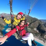 Harshika Poonacha Instagram - Sandalwood “Chitte” 🦋 and Mollywood “Neela Shalabham” 🦋 flying for real 🪂 How filmy 🙈🙈🙈 . . . My first Paragliding experience was as beautiful as these names 🪂 The feeling of being above the earth is surreal ♥️♥️♥️ I literally felt I had wings and I was flying 🦋🦋🦋 Thankyou @airborneparaglidingtr for this wonderful and thrilling experience 🤗 My pilot #tuna , my guide @atamantra and the driver 👍👍👍 You guys were amazing 🪂🪂🪂 I chose the most beautiful place on earth to sail myself in the sky and that is #turkey , Ahhhhh! The view from the top is ecstatic and so overwhelming,I was up there for more than 45 minutes and It’s something unreal and unimaginative what happens up there . Swipe right and if you see the last pic , you can actually feel like I’m above the globe 🌎 This was my #bucketlist No 25 I guess, And I did it ♥️ You all should do it too ! It’s ONE LIFE , so LIVE IT 💕 Fethiye Paragliding, Turkey