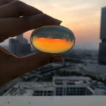 Ishaara Nair Instagram - How beautiful does the sunset looks through my opal crystal palm stone. I am a true libra and this is truly a gemstone for me. More crystals coming. Too excited ❤️😍😍😍😇 #healingstones #crystals #opal #opalpalmstone #hollyholistic Thank you universe and thank you @hollyholistic . Definitely going there for more purchase. Dubai, United Arab Emirates