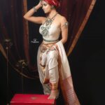 Madhuurima Instagram - This look is created using Offwhite pure silk with Red and Gold Jari Maheshwari Saree draped as dhoti paired with stapless corset top. The turban is made of red cotton silk Maheshwari fabric to complete the look #handwoven #weavesofIndia Maheshwar in Madhya Pradesh has been a centre of handloom weaving since the 5th century and the home of one of India's finest handloom fabric traditions. Please start including handwovens in your wardrobe... together we can make a difference to the artisan communities.. We all can put efforts to promote handloom products and support our handloom weavers. Design and Styling @mrunmayiavachat location & Outfit @nikayifashionstudio Makeup:Twinkley stars above Beautiful Drk eyes, Bright Lit Face & Nude Matte lips. Beautiful worries queen makeover for goureus @nyra_banerjee Mokever by @makeupartisthemal Draping and photography @mspiration_lakshmiwankhede This entire look was conceptualized keeping a warrior in mind and who better than nyra to portray it... Silver jewellery by @amoudinii #Sareelove #sarees #sareesofinstagram #offwhite #iwearhandloom #supportlocalartisans #vocalforlocal #handcrafted #handmade #authentic #fairprice #Bridal #Wedding #Festivevibes #ethnic #sareephotography #fashion #Red #indianwear #festive #saveourweaves #warrior #warrior princess #turban #womenwithturban #indianprincess #indianwarriorprincess