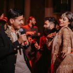 Mouni Roy Instagram - Happy tired feets at the sangeet🤩🧿• • • • Wedding planners : @neferrtitiweddings Decor & styling : @neferrtitiweddings Hospitality partner : @hiltongoaresort Filmography: @theweddingjournalsofindia Photography team : @priyamparikhpictures Hospitality management: @Bgc.event Technical partner : @resonateproblr DJ: @dj_sharath Unforgettable memories created by @reemasang @studioneelabh After party @thehimanisingh @databass_music