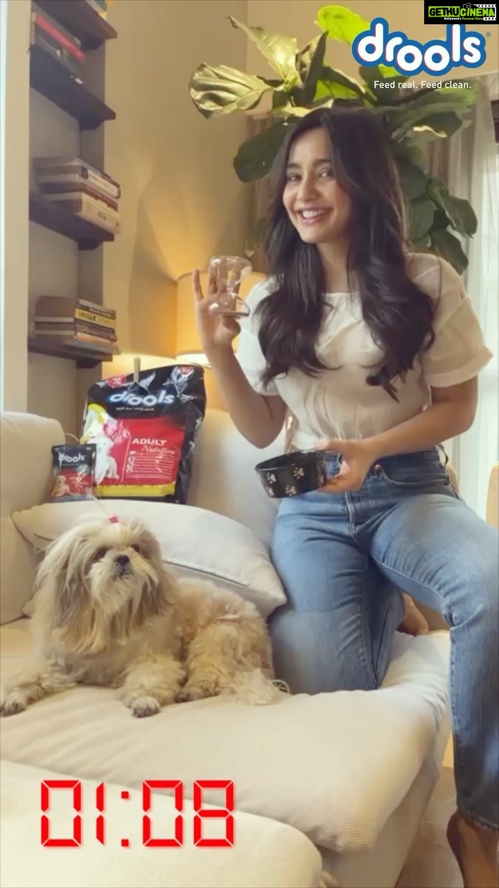 Neha Sharma Instagram - Joy and I took the #TimeToDroolChallenge! Now lets see how long your furry friend takes to finish his lip-smacking delicious bowl of @Drools! Send in your videos to @DroolsIndia and take the challenge!