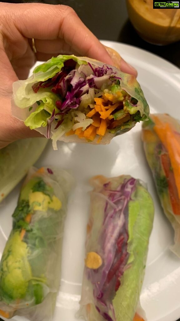 Parvathy Omanakuttan Instagram - One of my favorite things to eat on a lazy evening is this scrumptious, flavour bomb of fresh vegetable spring rolls. This is a house favorite and since a lot of people asked me how I made it , here’s the video. The video for the dipping sauce will follow shortly since I had made the previous batch with what I had in my pantry as a total experiment and I honestly did not expect it to taste better than the traditional peanut dipping sauce that is served alongside these rolls in restaurants. (It was over even before I imagined) Ingredients: *Rice paper wraps *Carrot *Celery *Lettuce *Bell peppers (red, yellow, orange , green) *Red cabbage or White cabbage *Beetroot *Avocado *Coriander / mint / parsley (chiffonade) *Lemon juice *Togarashi / red chilli powder / black pepper/ sesame seeds (for added flavor) P(a)RO TIP :- 1) Use a vegetable slicer or a peeler to cut the vegetables evenly thin and then use your kitchen knife to cut them into strips. (maybe I will do a video on how I do my meal prep which helps cooking seem way more easier than what people think) 2) Do not leave the rice paper in water for more than 20 secs, it will be a nightmare to get it off the board or surface without it tearing. Enjoy #foodie #instafood #food #yummy #foodblogger #chef #veganfood #foodgasm #homemade #foodnetworkkitchen #foodnetwork #delicious #foodforthought #buzzfeedfood #foodaddict #love #dubaieats #dubai #healthyfoodshare #healthyfoods #healthyfoodie #foodaddict #gramslayers #foodnetworkstars #foodnetworkkitchen #foodporn #foodnetworkasia #lovetoeat #livetoeat #plantbaseddiet @carrefouruae @josephradhik I have shot a bit of the video inspired by your recent story ;)