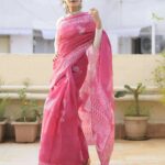 Payal Rohatgi Instagram - New Launch ✨ Light as a feather, the ethereal Pink Moonga Doria Saree is a must-have in your saree collection. This saree embodies a unique squared check pattern further adorned with the classic motifs on lively hues, carry your grace with flying colors . Perfect for your high tea evenings and casual day out. Free-spirited and feminine; @payalrohatgi sure knows how to steal our hearts! 📸 @shutterjuicestudio Shop now: Link in bio . . . . . Also, shop our entire collection available at @amazonfashionin #outfitgoals #tamairafashion #outfitinspiration #cottonsarees #mulmulsaree #purecotton #sareestore #sareestyle #sareeinspiration #loveforcotton #lovesaree #sareecollection #onlinesareestore