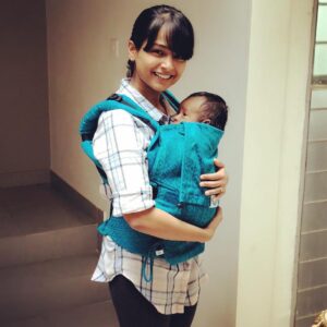 Poornitha Instagram - Okay guys, those who follow my instastories know that the sweetest people @soulslings sent over a cutest package of their soulsling for me to try out with little baby Navya :) My husband (read: the most amazing baby daddy) and I have some travels coming up and I was originally going to whip out the soulsling carrier out to help us out then but all of you know how impatient I am, we decided to use it for our travel from our room to the kitchen which is a floor below 😂 
I was pleasantly surprised by how comfortable these slings are for both me and little baby N. Such comfortable soft fabric letting me snuggle my baby (it's like giving her a hug constantly.. now how cute is that!), good support which come with completely adjustable slings so that both me and my husband (who is twice as tall as me) can use it seamlessly 😂
Even though tiny little Navya is not big enough for these slings so that her legs can hang out of them, she was still totally comfortable all curled up inside it and it gives great support both for her head and her mommy's back! 
Such a great product, I can't wait to use it regularly and see little baby Navya grow in it :) Thanks again @soulslings for sending this over. Do check out their page, new mommas and do yourself a favor by treating yourself and your baby to one of these :) #soulslings
#soulslingsindia #babywearingwithsouls #CuddlePartyWithNavya #ConstantSnuggles#vsco #vscocam