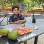 Prakash Raj Instagram - My little farmer son with the gifts of nature @vedhantprakashraj @lifeatprakasham #lifeinthefarm #bliss