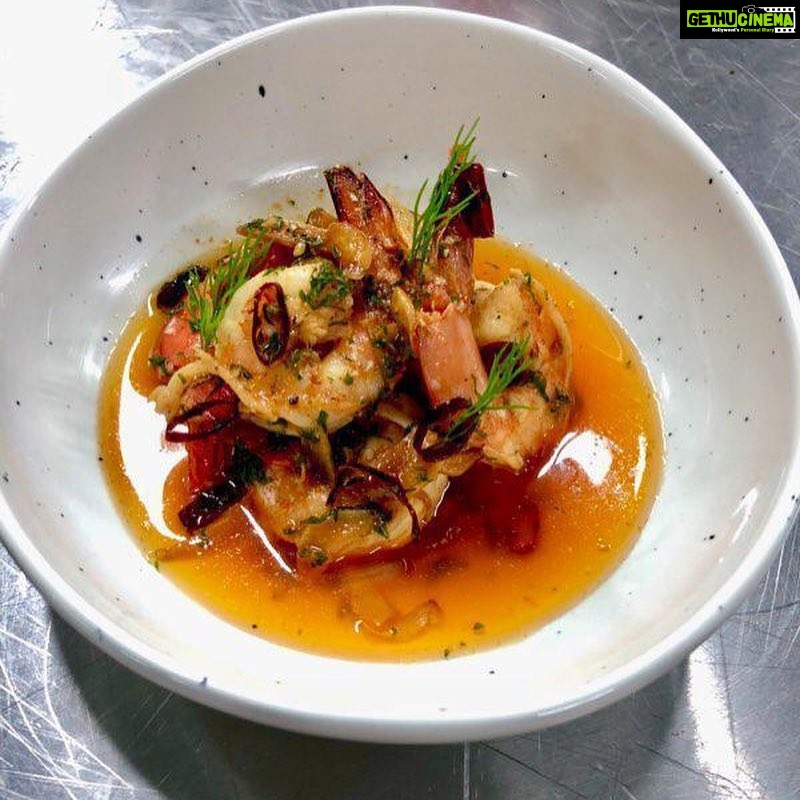Rahul Bose Instagram - Delicious food @unomasindia the new #tapas place at #BKC Thoughtfully made, different flavours, fresh ingredients. 👍🏽 Take a bow co-owners @anka.sharma and @pallo_j Wasn’t drinking, but sipped a whisky cocktail - very good. Images : Gambas al ajillo - prawns in garlic and prawn head oil ; Paella Pollo ; Patatas machaconas - crispy pork belly in spicy potato mash with pork crackling ; Codornices - grilled quail with pomegranate molasses ; Tortita de camarones - shrimp pancake