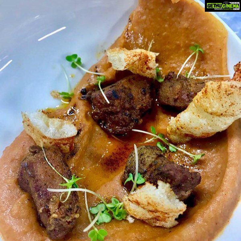 Rahul Bose Instagram - Delicious food @unomasindia the new #tapas place at #BKC Thoughtfully made, different flavours, fresh ingredients. 👍🏽 Take a bow co-owners @anka.sharma and @pallo_j Wasn’t drinking, but sipped a whisky cocktail - very good. Images : Gambas al ajillo - prawns in garlic and prawn head oil ; Paella Pollo ; Patatas machaconas - crispy pork belly in spicy potato mash with pork crackling ; Codornices - grilled quail with pomegranate molasses ; Tortita de camarones - shrimp pancake