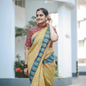 Remya Nambeesan Instagram - Flaunting in this yellow sari 🥻!! Beautiful earrings @yoursethnically !! @devraagh @pranavraaaj