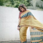 Remya Nambeesan Instagram - Flaunting in this yellow sari 🥻!! Beautiful earrings @yoursethnically !! @devraagh @pranavraaaj