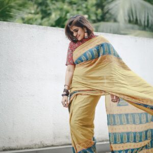 Remya Nambeesan Instagram - Flaunting in this yellow sari 🥻!! Beautiful earrings @yoursethnically !! @devraagh @pranavraaaj