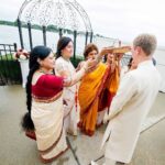 Richa Gangopadhyay Instagram - Remembering our beautiful, waterfront Indian ceremony that took place on this day, last year, and how special it was for our families to come together as Joe and I completed our Hindu Bengali rituals together (Joe is a master at reciting mantras, nbd). We were lucky to have been able to honor both our cultures and traditions and to have Joe’s family embrace, and enthusiastically participate in every nuanced element of our celebrations with open arms. ⁣⁣ ⁣⁣ From the “gaye holud” (haldi/turmeric ceremony), to the “ayeburobhaat” (bride-to-be’s final luncheon with her favorite dishes), “totto” (or tatwa, groom welcomes the bride to their family) and “bor boron” (bride’s mother and female friends welcome the groom), each distinctive event bonded us closer, for life.🔒♾️⁣⁣ ⁣⁣ I can’t even put into words how utterly grateful I am, and always will be, to my parents for giving their only daughter a wedding that dreams are made of. To have our extended family and friends from all over celebrate our union over the three-day wedding events was indescribable, and on our anniversary, revisiting over 3000 photos brings us back to the fun, laughter, tears of joy (and yes, of course a little bit of chaos…it’s a fusion wedding!). 🥳⁣⁣ ⁣⁣ We are blessed beyond words, for having each other and for having our families love and support us till the very end. We love you Ma, Baba, Deb and Steve!🥰⁣⁣ ⁣ Venue: @roostertail Makeup: @jhobby21 Hair: @hairbyaysha 📷: @kelliesaunders Detroit, Michigan