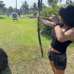 Sakshi Agarwal Instagram - Nothing clears the mind like an afternoon out shooting🏹🏹 . My first time ever! Learning a new skill😋 . #goa #archery #beginner #shoot #archerylifestyle #instapic #holidays #vibing The Leela Goa