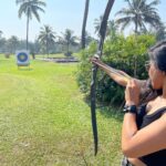 Sakshi Agarwal Instagram - Nothing clears the mind like an afternoon out shooting🏹🏹 . My first time ever! Learning a new skill😋 . #goa #archery #beginner #shoot #archerylifestyle #instapic #holidays #vibing The Leela Goa