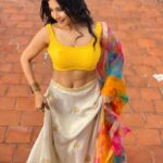 Sakshi Agarwal Instagram - She has fire in her veins and embers in her eyes🔥 . #lehenga #traditional #sakshiagarwal #biggboss #instapic #waistchain #beyourself #candid #soakingupthesun #instadaily #yellowblouse #lehenga #colourfuldupatta #fashion #lifestyle Chennai, India