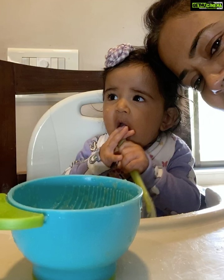 Sameera Reddy Instagram - Feeding Nyra is like playing fastest finger first ! đ€Ł she wants to grab the bowl ! Chew the spoon ! And spit the food ! đ #motherhood #fun #weaning #mommylife #momlife For mommies interested in her diet ! Nyra is almost 7 months . I started feeding her about 6 weeks ago! I started with only purĂ©es of avocado đ„ ( raw soft mashed without the pit) I gave her that to begin with and it worked really well . I then introduced single semi liquid purĂ©es that need to be steamed and purĂ©ed - pear / apple / pumpkin / sweet potato / carrots . You can directly purĂ©e papaya / avocado / bananas. These are all@great first foods ! I also introduced ambemohar rice after a few days of weaning that is super nice for babies . I cook till very soft and then used a big eye sieve to give it a nice texture . ( @mumbaimummy this was a great tip thank you ) Moong Dal is very light so works well to start with rather that other dals. I make it with the rice sometimes or just on itâs own. ( I add pinch of hing and jeera powder ) FYI I donât use any fancy steamers . Just a simple pressure cooker with a steel bowl inside . I do not add salt or sugar . Use your instinct when it comes to feeding . What the baby will love today they will fuss about tomorrow. But just donât stress about it . Itâs imp to continue the Breast Milk and /or Formula . My BIG TIP . I play the same song At every meal . It makes her comfortable and she knows it time to eat ! â€ïžđ