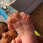 Sameera Reddy Instagram – I watch her enjoying the water on her little fingers as she holds her toes for the very first time. The awe on her little face is breathtaking. Such small joys we forget and these little beings remind us that life is so fragile and we forget how amazing it really is ❤️ #motherhood #life #blessed #gratitude #moments #nyra 🙏🏼