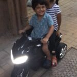 Sameera Reddy Instagram - Already taking girls for a spin !! 😍 . . . #myson #littleman #moments #summer #holiday #motorcycle #kidstagram #momlife #myboo ❤️