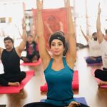 Sanjjanaa Instagram - Releasing a set of wonderful yoga pics … reliving previous yoga days of my life … #gocoronago … Because of the COVID having a digital celebration of international yoga day today .. sharing pics on my Instagram .. Email us if you need wonderful new videos or extract my New yoga videos posted on my Igtv 5 days ago . Feel free to spread the msg of Yoga & good health through these lovely of me performing yoga with my Yoga Guru ji Amar shri Vidya ji … Happy digital international yoga day . I would like to share my knowledge about Acro Yoga , Let’s start with explaining the Roles in Acro Yoga , Roles There are 2 important roles in an Acroyoga practice: The base & the Flyer . Base - this is the individual who has the most points of contact with the ground. Often this person is lying on the ground with the entire back torso in full contact. This enables both the arms and legs to be "bone-stacked" for maximum stability and support of the Flyer. Main points of contact with the flyer are the feet (generally placed on the Flyer's hips, groin or Abs ) and the hands (which either form handholds or grasp the shoulders). Flyer {referring to my self in the pic } - this is the individual who is elevated off the ground by the Base {base partner is Referer to my Guru ji in the pic } . The Flyer can move into a series of dynamic positions, A Flyer needs balance, confidence, and core strength developed over years of practice through Yoga / Acro yoga . (Continued… ) Bangalore, India