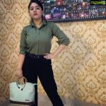 Shriya Sharma Instagram - Work From Home edition! Wearing this comfortable olive shirt from @trend_2020_collection , the black formal pants from @the_shop_valley and the chic pastel bag from @trend.__.store #shriyasharma