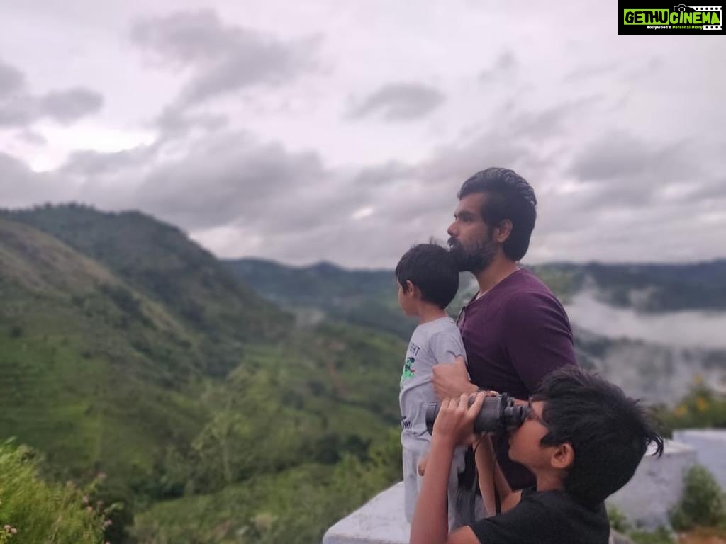 Sibi Sathyaraj Instagram - The best thing I like about a Binocular is that it gives a laser pointed view and focus on what lies ahead of us without ever looking back! #familytime #goals #dad #sons #actorslife #sibiraj #sibisathyaraj #dheeransibiraj #samaransibiraj #brothers #farmhouse #nilgris #futuregoals #futuristic #future #ahead #dream #reachyourgoals #naturephotography #nature #naturelovers #mountains #clouds #views #greenery #hillstation #hillstationsofindia #favouritedestination #travelgram #photooftheday