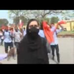 Sonia Mann Instagram - When a #hijab student arrives at PES college in #Mandya. She gets heckled by students wearing #saffronshawls chanting #JaiSriRam . She raises her hand says #AllahuAkbar before being escorted by college staff . Video countesy.#karnataka #support #truth #justice