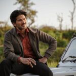 Dulquer Salmaan Instagram - Put on your seatbelts and get ready for a ride back to the 90s with me. Here’s presenting my first look from Guns & Gulaabs, my first ever webseries and my first collab with the amazing duo @rajanddk. @rajkummar_rao, @gouravadarsh, @tjbhanu, @gulshandevaiah78 and our other talented co-stars will join me for this thrilling ride. 🚗 Guns & Gulaabs is created, produced & directed by @rajanddk @d2rfilms , coming soon on @netflix_in 🔫🌹