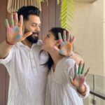 Mouni Roy Instagram - May your lives forever be filled with colours of joy, love & laughter 💙💚💛🧡❤️💜🖤🤍🤎 HAPPPPPYYYYYYY HOLIIIIIIIIIIIII 💦 #ourfirst 🔆🔱