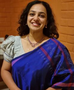 Nithya Menen Instagram - Tangaliya or Daana weaving 🧵  from Gujarat is mainly practiced by the Dangasia community. It's history spans back over 700 years ! :) 🕰 

 The legend goes, that a young man from the shepherding community of Bhadwad , fell in love with a young lady from a neighbouring weaving community🧶 and married her .  His family disapproved of the match, and the young couple were made unwelcome. So they settled with her family of weavers and he continued to herd sheep. As he learnt the craft of weaving, he started to use the wool from his sheep 🐑  and thus the art of Tangaliya weaving came into being !  Within the Dangasias and Bhadwads communities, no special occasion was complete without draping or gifting tangaliya weave 

This craft was unknown to the world until 2007-2008, when it received the GI (Geographical Indication) certification, during the design intervention project by NIFT. The Dangasia community became well known for their tangaliya weaving. However, when the project ended the system started to lose its dynamics.

Today, with the introduction of less expensive, printed textiles in the market, many traditional weavers and their descendants are sustaining themselves by working as labourers in factories and farms or migrating to the cities in search of working opportunities.
@isha.savetheweave 
Thank you @lakkarajusailaja for letting me wear your mothers necklace🤎🤎 😊