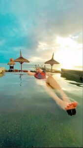 Aarti Chhabria Instagram - “Water meditation entails feeling weightless and present, being one with the water and allowing the flow state.” Blissful Living . . . . . Aarti’s Blissful Living X The Oberoi, Mauritius Experiencing the magical sunset while relaxing in their infinity pool, truly blissful living. . . . . . . . #bliss #blissfulliving #blissfullife #watermeditation #infinitypool #theoberoi #theoberoimauritius #aartichabria #universalmind #motivation #theoberoi #floating #sea #beach #pool #blackswimmingcostume #swimmingpool #swimwear #aartichabriaquotes #bluesky #openarms #victoriousmindset #luxurytravel #holisticwellness #wellness #luxurylifestyle #luxurylife The Oberoi Beach Resort, Mauritius