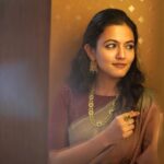 Aparna Das Instagram - Jewelry is the most transformative thing you can wear. And I love how each jewelry from @dcjewellers.official changes the look of the saree I'm wearing ….. from statement jewelry to traditional jewelry. They have an amazing range of collection at very reasonable price Feel good and look good with @dcjewellers.official Find your unique piece at @dcjewellers.official , Thrissur Makeup and hair styling : @makeupbysanakbarsha 👗 @zohibzayi #goldjewellery#jewelry#jewellerydesign#jewellery