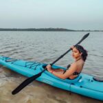 Amala Paul Instagram - Row row row your worries away on a sunny day! 🌞 🏖️ #kayak #backwaters #waterbaby #rowrowrowyourkayak