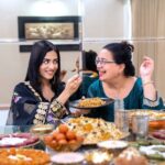 Amrita Rao Instagram - Happy Mother’s Day to all the L😍vely Moms out there! 🥂 Here's Mom & I, celebrating Her inspirational journey over a royal spread of biryanis, kebabs & desserts from the bessst we have in town @behrouzbiryani 😃😋 ✨ When most Mothers her age succumbed to societal norms, my mother broke the cliche and laid the foundation to be an independent woman. She didn’t give in to the family imposed guilt of quitting her job to look after me when I was born and resumed work just 45 days later. She was determined to strike a balance and she did! The journey wasn’t easy, but Mom made every bit of the ride worth it ! Not once did I ever feel the absence of her presence and care. Every day after school, I’d call and tell her & She’d be just a call away & not once said she was busy & could speak to me. ❤️ From sporting a boy cut hairdo then to wearing the clothes of her choice to riding a two-wheeler, mom has always done what she wanted to. She gave me the same freedom and space to be my own person and never imposed anything on me. ☺️ For someone so special, I only want to give her the bessst! 😍 Today, on Mother’s Day, I’m celebrating and saluting my Mom by treating her to a feast fit for a Queen 👑 - a royal lavish spread of mouth-watering biryani, delicious kebabs and indulgent desserts from Behrouz Biryani. Kyunki, kuch pal sirf Behrouz se khaas bante hain! #behrouzbiryani #biryani #mothersday #mothersdayspecial