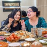 Amrita Rao Instagram - Happy Mother’s Day to all the L😍vely Moms out there! 🥂 Here's Mom & I, celebrating Her inspirational journey over a royal spread of biryanis, kebabs & desserts from the bessst we have in town @behrouzbiryani 😃😋 ✨ When most Mothers her age succumbed to societal norms, my mother broke the cliche and laid the foundation to be an independent woman. She didn’t give in to the family imposed guilt of quitting her job to look after me when I was born and resumed work just 45 days later. She was determined to strike a balance and she did! The journey wasn’t easy, but Mom made every bit of the ride worth it ! Not once did I ever feel the absence of her presence and care. Every day after school, I’d call and tell her & She’d be just a call away & not once said she was busy & could speak to me. ❤ From sporting a boy cut hairdo then to wearing the clothes of her choice to riding a two-wheeler, mom has always done what she wanted to. She gave me the same freedom and space to be my own person and never imposed anything on me. ☺ For someone so special, I only want to give her the bessst! 😍 Today, on Mother’s Day, I’m celebrating and saluting my Mom by treating her to a feast fit for a Queen 👑 - a royal lavish spread of mouth-watering biryani, delicious kebabs and indulgent desserts from Behrouz Biryani. Kyunki, kuch pal sirf Behrouz se khaas bante hain! #behrouzbiryani #biryani #mothersday #mothersdayspecial