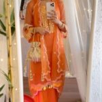 Erica Fernandes Instagram – Orange is the new black only for today 🧡🤭

Outfit : @lahario_
Jewellery : @ishhaara
Juttis : @kala.india
Potli : @handbagsbybhavnakumar

#reelitfeelit #fashionreels #eidlook