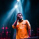 Haricharan Instagram - Felt Sooooo good to be Back on Stage with my Band. Thanks to the wonderful audience for Singing along 😍😍 Last Night at Thiruvananthapuram for the Inauguration of @keralaolympic Pics by @ebysolickal University Stadium