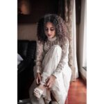 Pearle Maaney Instagram - It’s time to thank @labelmdesigners for this lovely Wedding Gown...for making my special day “Dreamy”. Also... I’ve found two amazing friends... Anu and Reshma.. the brains and soul of @labelmdesigners ❤️😘 . . . It’s an Ivory straight sheer gown The style that we adapted this time was very Victorian in aspects of its detailing and cuts ! The silhouette is a minimal straight long gown with a slightly flared hem! Even though it appears to be very minimal as per its silhouette it has very maximalist details as it consists of various minute panelling and lace insertions . Every panel has been intricately embroidered separately by our extremely proficient craftsmen for months . An entire ivory rose garden has been appliqués and beaded intricately all over and a tinge of pale pinks and powder blues to accentuate its depths It’s very modern but extremely rooted to our ancestoral Victorian elegance. . . Heels from @inc5shoes @sainu_whiteline photography Event by @eventiaevents Make Up by @sebastian.miranda.3998