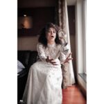 Pearle Maaney Instagram - It’s time to thank @labelmdesigners for this lovely Wedding Gown...for making my special day “Dreamy”. Also... I’ve found two amazing friends... Anu and Reshma.. the brains and soul of @labelmdesigners ❤️😘 . . . It’s an Ivory straight sheer gown The style that we adapted this time was very Victorian in aspects of its detailing and cuts ! The silhouette is a minimal straight long gown with a slightly flared hem! Even though it appears to be very minimal as per its silhouette it has very maximalist details as it consists of various minute panelling and lace insertions . Every panel has been intricately embroidered separately by our extremely proficient craftsmen for months . An entire ivory rose garden has been appliqués and beaded intricately all over and a tinge of pale pinks and powder blues to accentuate its depths It’s very modern but extremely rooted to our ancestoral Victorian elegance. . . Heels from @inc5shoes @sainu_whiteline photography Event by @eventiaevents Make Up by @sebastian.miranda.3998