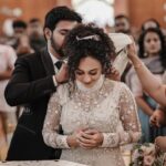 Pearle Maaney Instagram - We received all your blessings... ❤️ Thank You !!! 😘 @srinish_aravind . . . @sainu_whiteline Click Thank u for this beautiful Dream gown by @labelmdesigners Event by @eventiaevents Srini’s suit by @men_in_q_wedding #pearlishwedding Make up @sebastian.miranda.3998 Hair @sudhiar991