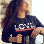 Pearle Maaney Instagram - “Love Yourself The Way You Are.. Love The World The Way it is.” . Where have you heard these Lines?Comment Below 😌 . This month it’s all about Love and it’s the Perfect Piece that can be Added to Your Wardrobe. ❤️ Wear Some Love as You Celebrate Love 😋 . BUY Your Favourite Sweatshirt/Hoodie/ T-shirt on pearlemaaney.themerchbay.com . Available in More Colours and All Sizes! Link in Bio 🥰❤️ . PS: Our Peace Love Music Mugs are now my Fav 😋 #pearlemaaneymerch