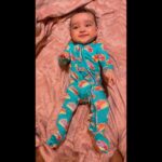 Pearle Maaney Instagram - Because A Baby’s Smile is the most beautiful sight…. And i want to share that privilege with all of You 🥰❤️ Hope her Smile makes you smile too… Your Nila Baby is all smiles before going to bed, Also All your Prayers Love and Blessings have kept her Happy Always. ☺️♥️🧿 . She is wearing her favourite @poshpeanut Footie Ruffled Zipper Onesie