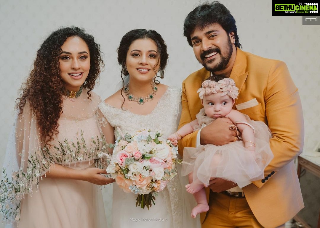 Pearle Maaney Instagram - Srini and I love you so much Vavachi 😘 Meanwhile Nila’s Mind Voice: “No, I won’t let go of my Mema.. she is mine” 😏 . By the way Nila is also wearing @t.and.msignature . @srinish_aravind looks handsome in @men_in_q_wedding