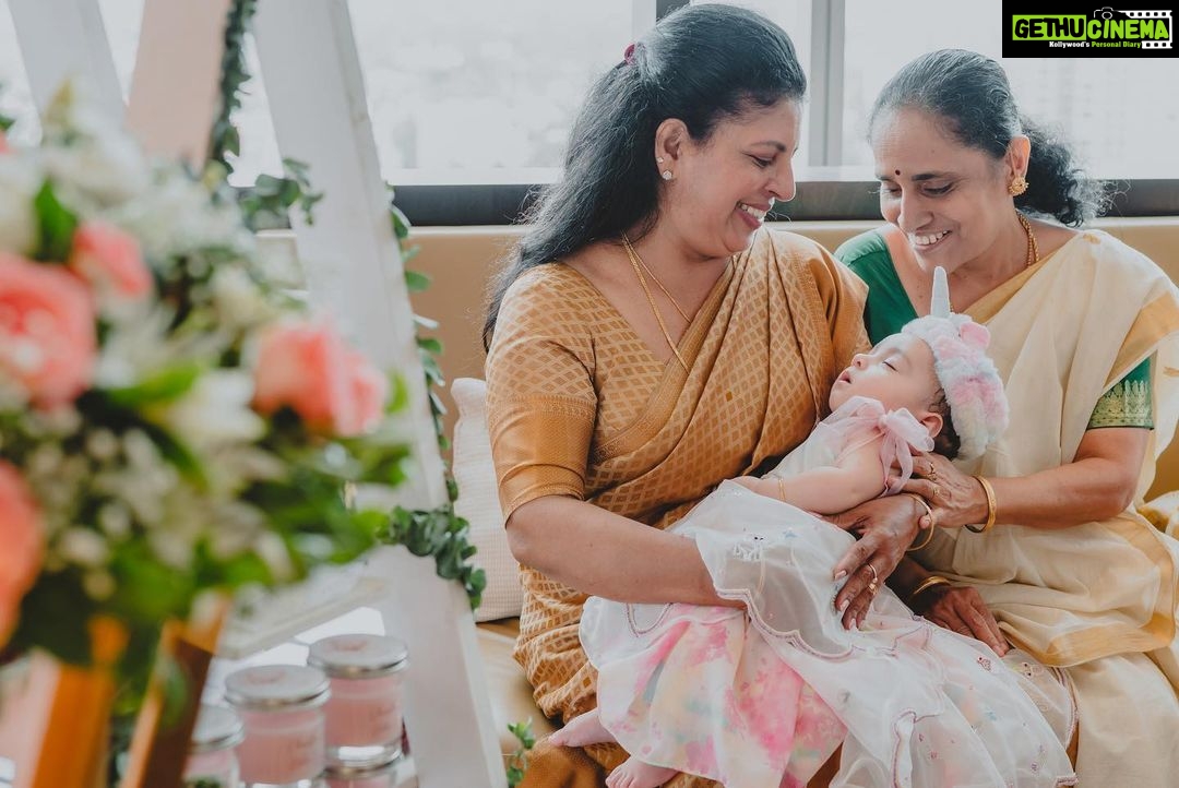Pearle Maaney Instagram - Nila’s Baptism ♥️ Swipe Right 🥰 . . . Click @magicmotionmedia Srini’s Suit @life_of_colours_ Nila and Pearle wearing @t.and.msignature @m.o.dsignature