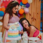 Pearle Maaney Instagram – Silence Please! They are trying to have a conversation here! 😜😋
.
So this post is all about my little sister who has been happiest since she got to know I was pregnant… she has been extremely nice to me… she makes sure I’m always comfortable and she is great at surprising me. For past 2 months she has been planning this baby shower and it’s not easy to pull of something like this during a pandemic. She tried to bring most of my friends to this event and she created the most colourful baby shower ever! I felt like I was in a dream when I entered the room and happy tears rolled down my cheeks… Now Tell me… how lucky am I to get a sister like Miss @rachel_maaney 😘😘😘 My Vavachi ❤️🌸 and @rubenbijy my future brother in law… for giving her all the support she needed 🌸🦋
.
.
.

Clicks : @magicmotionmedia 
Cakes @whisk_n_frost
Costume @think_over_things_signature
Decor : @thefetecompany 
Make up : @themixandbrows 
Tiara @wowcrafts_
Venue : @pranaayurvediccentre